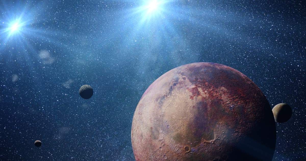 Representative image of planets and moons in a binary star system. (Cover Image Source: Getty Images | Photo by dottedhippo)