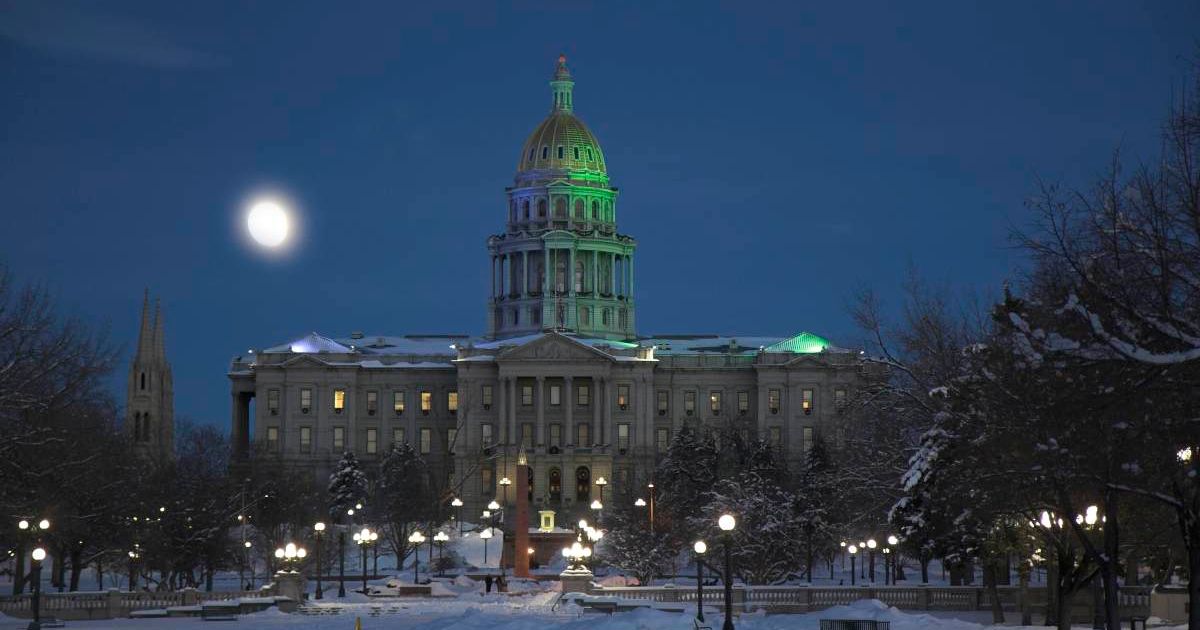 A full moon glows in the night sky over the Colorado State Capitol building in Denver on a winter evening. (Cover Image Source: Tony Savino/Corbis via Getty Images)