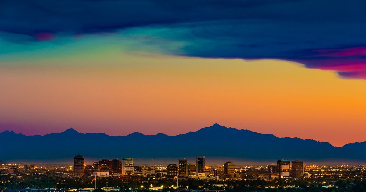 Phoenix skyline under a dramatic sunset as seen from Scottsdale. (Cover Image Source: Getty Images | dszc)