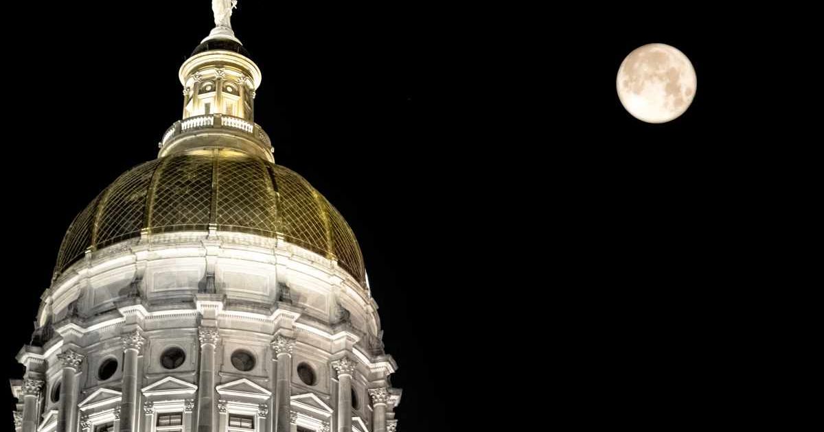 Full moon next to the gold dome of the Georgia State Capitol Building in Atlanta, Georgia, USA. (Cover Image Source: Getty Images| Nathan McDaniel)