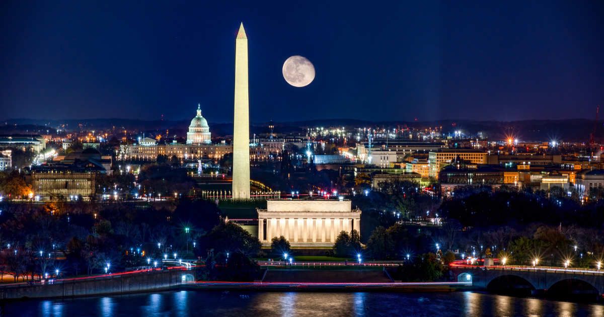 A picture of illuminated Washington DC at night with the US. Capitol, Washington Monument and the Lincoln Memorial visible with a Waning Gibbous Moon. (Cover Image Source: Getty Images | Amy Sparwasser)
