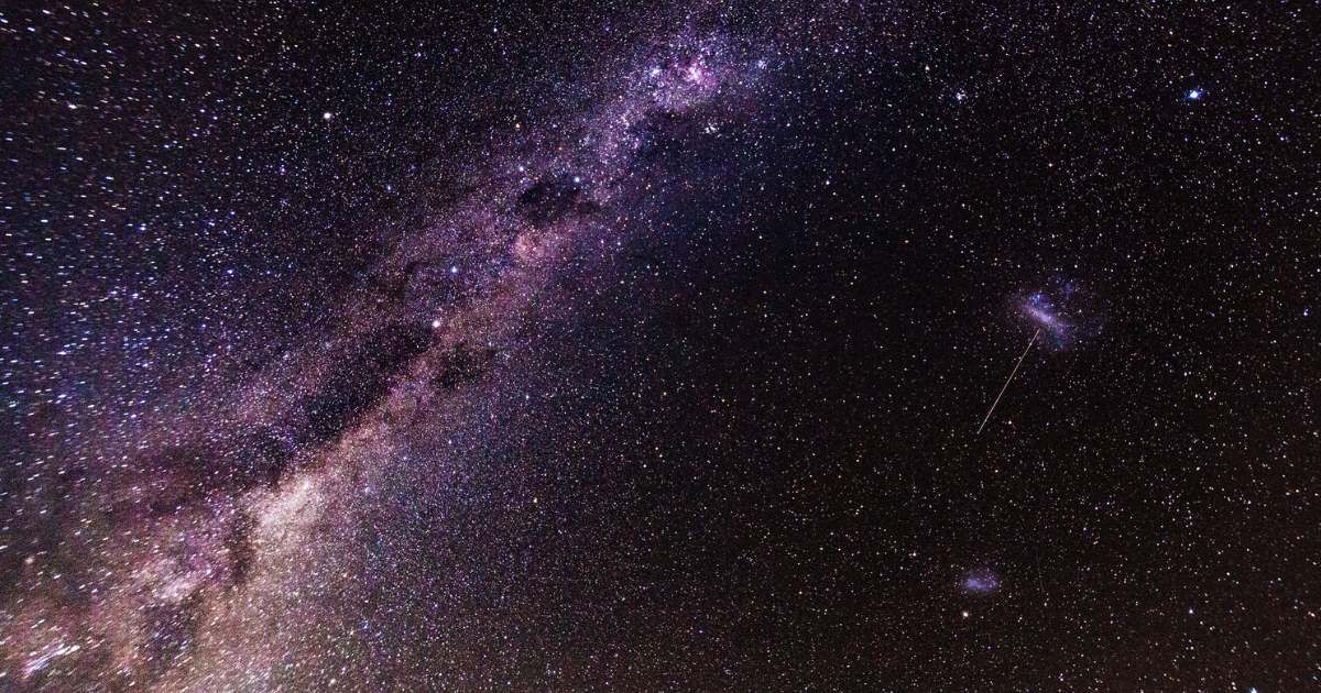 Image of the Milky Way streaking through the night sky as seen from Earth (Representative Cover Image Source: Getty Images | Photo by Anton Petrus)