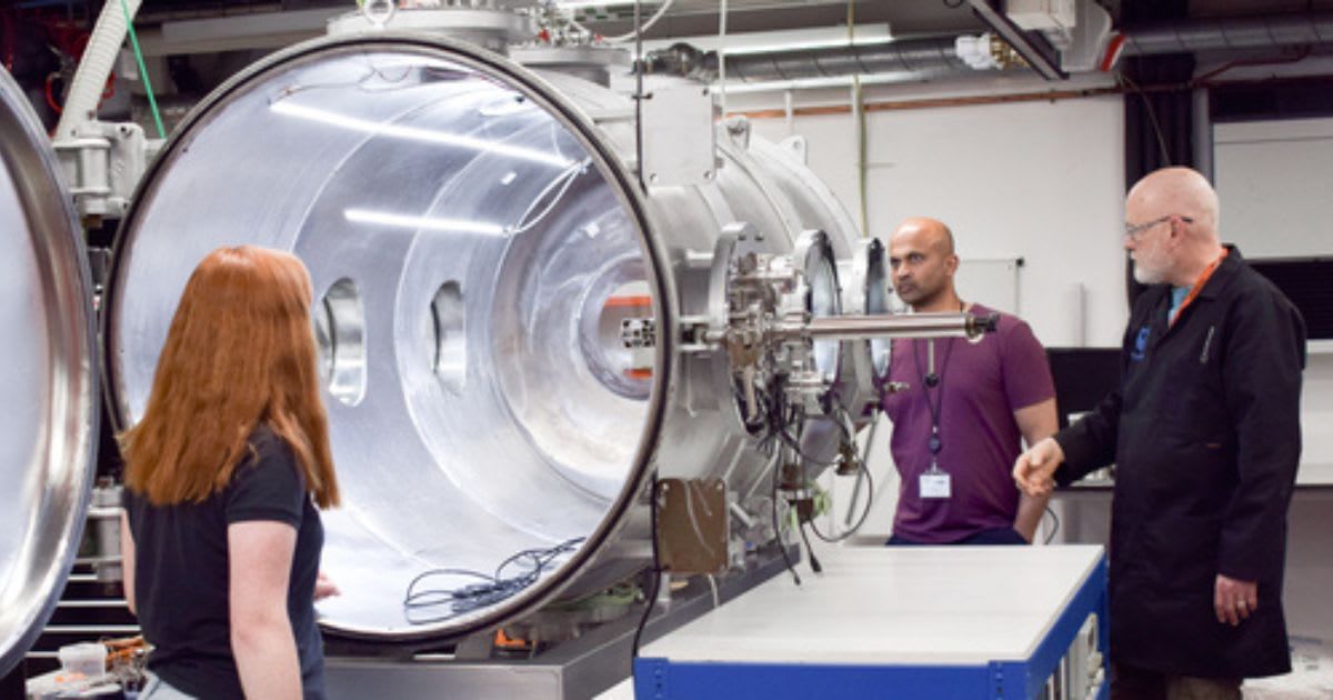 Prof. Manish Patel, Dr Matthew Sylvest and Dr Zoe Emerland discussing experiments by George - The Large Dirty Mars Chamber (Cover Image Source: Open University)