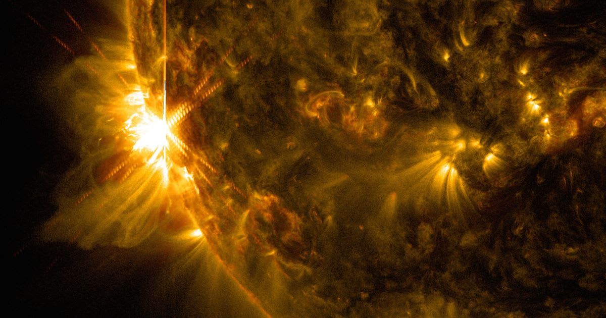 A solar flare bursts off the left limb of the sun in this image captured by NASA's Solar Dynamics Observatory on June 10, 2014 (Cover Image Source: NASA Image and Video Library | NASA)
