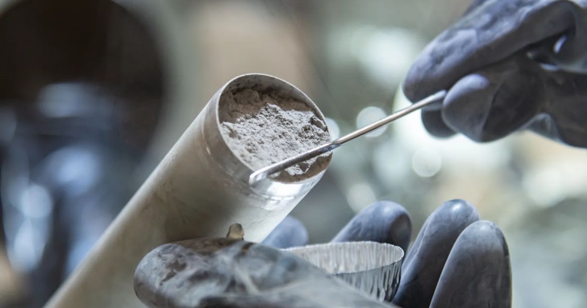 A close-up of Apollo 17 lunar core sample 73001 being taken out of its drive tube for the first time since it was collected by Apollo astronauts in December 1972 at NASA’s Johnson Space Center in Houston (Cover Image Source: NASA | Robert Markowitz)