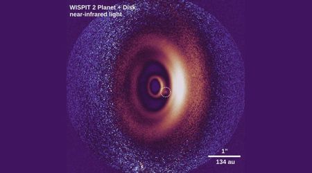 Astronomers unexpectedly capture a planet's birth within the swirling disk of a young star