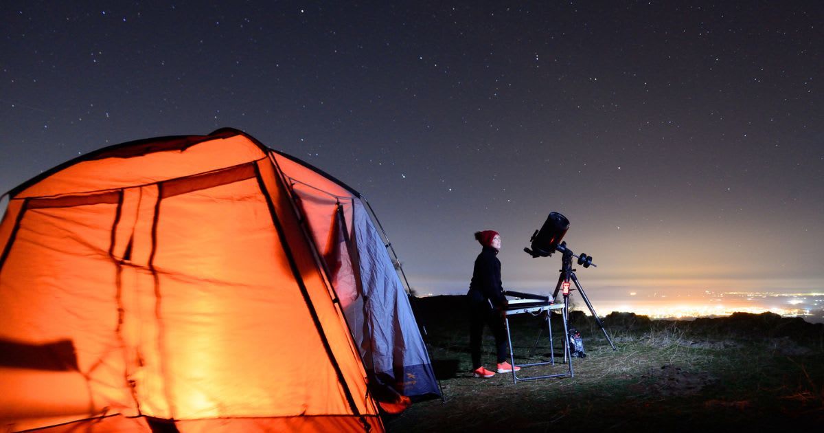 Young woman fond of astronomy observing through her telescope (Representative Cover Image Source: Getty | JULIAN74)