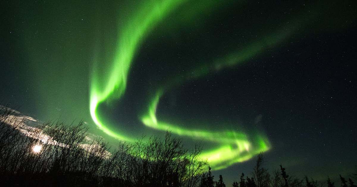The Aurora Borealis appears in the sky on January 8, 2017 near Ester Dome mountain about 10 miles west of Fairbanks, Alaska (Representative Cover Image Source: Getty | Lance King)