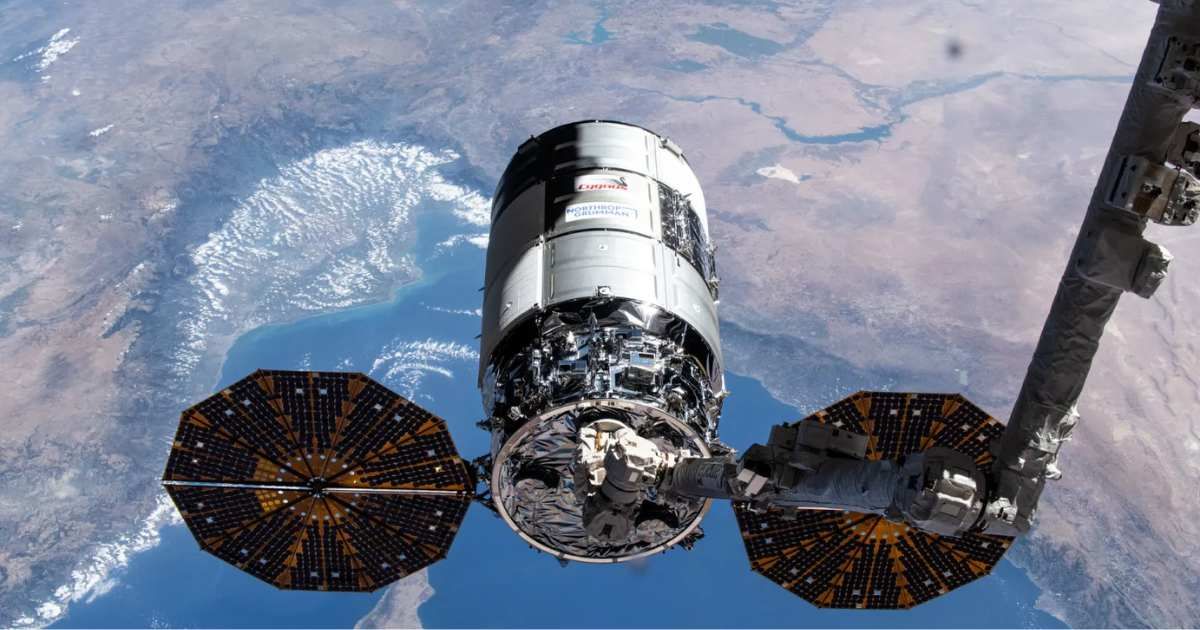 Northrop Grumman’s 21st Cygnus cargo craft, with its prominent cymbal-shaped UltraFlex solar arrays, is pictured in the grips of the Canadarm2 robotic arm shortly after its capture on Aug 6 (Cover Image Source: NASA)