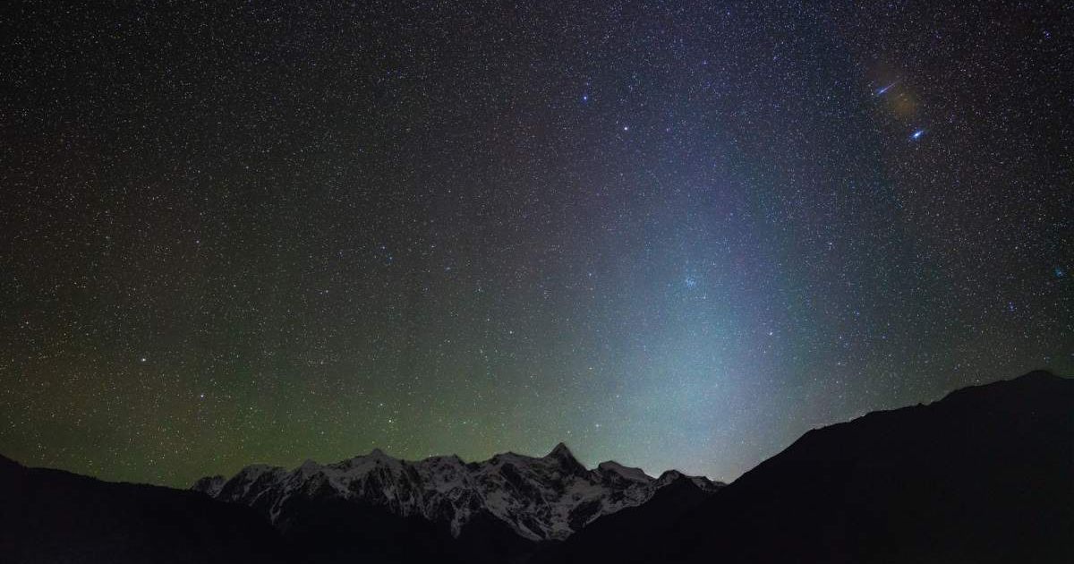 Meteor and zodiacal light shine bright in the night sky above the Himalayas. (Representative Cover Image Source: Getty Images | Photo by Haitong Yu)
