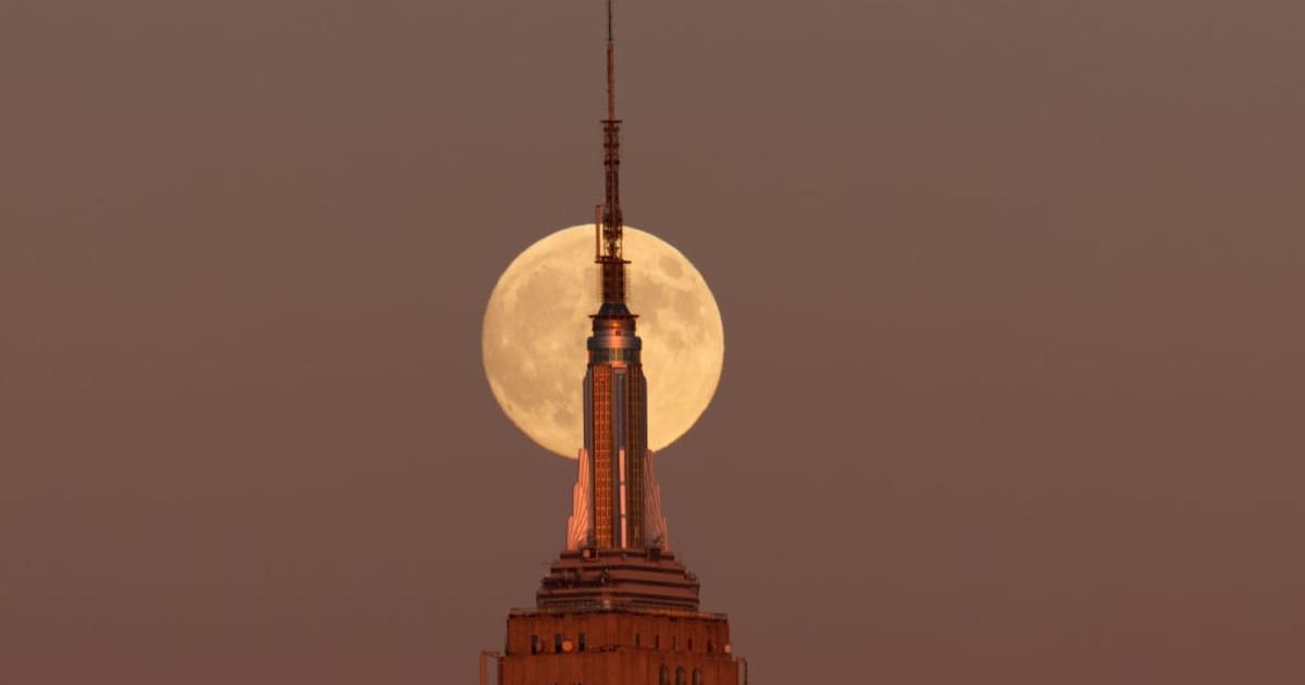 The Hunter's Supermoon rises behind the Empire State Building in New York City as the sun sets on October 16, 2024 (Cover Image Source: Getty | Gary Hershorn)