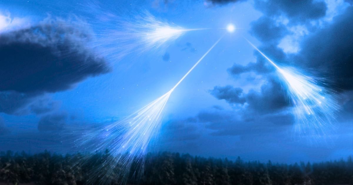 Artwork of high-energy particles and radiation from a star in deep space (cosmic rays) impacting molecules and atoms in the Earth's atmosphere. (Representative Cover Image Source: Getty Images | MARK GARLICK/SCIENCE PHOTO LIBRARY; edited by Starlust staff