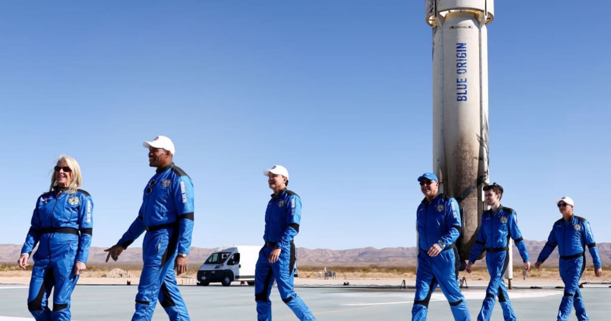 Laura Shepard Churchley, Michael Strahan, Dylan Taylor,Lane Bess, Cameron Bess, and Evan Dick, walk during a media availability on the landing pad after they flew into space aboard Blue Origin’s New Shepard (Cover Image Source: Getty | Mario Tama)