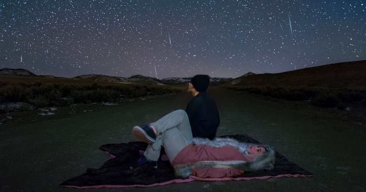 Teenagers watching a meteor shower (Representative Cover Image Source: Getty | harpazo_hope)