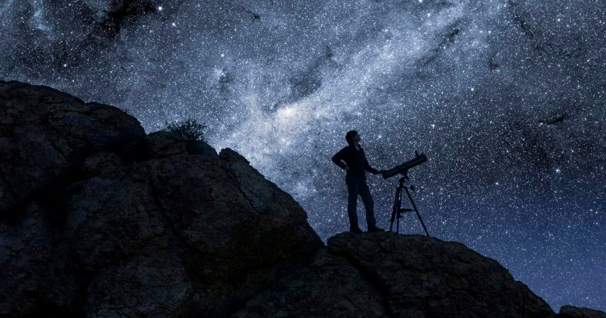 Stock image of a man stargazing in the desert (Representative Cover Image Source: Getty | Bryan Allen)