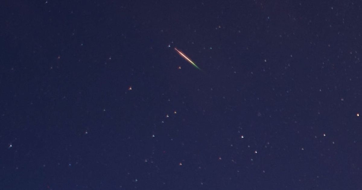 A brightly coloured meteor can be seen as it streaks across the early morning sky on August 13, 2013 over Saltburn, United Kingdom.  (Representative Cover Image Source: Getty Images | Photo by Ian Forsyth)