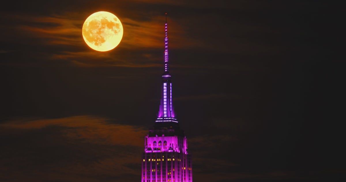 The full Harvest Supermoon rises behind the Empire State Building in New York City on September 17, 2024. (Representative Cover Image Source: Getty | 	Gary Hershorn)