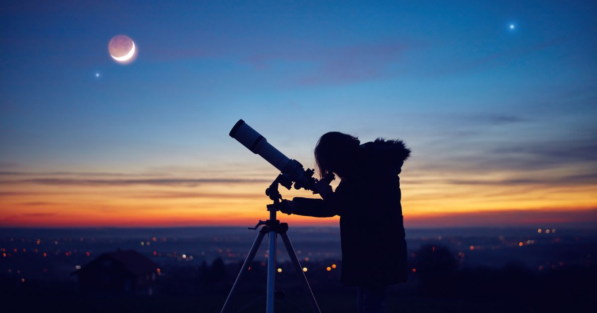 A girl observing stars, planets, the Moon, and the night sky with an astronomical telescope (Representative Cover Image Source: Getty | m-gucci)