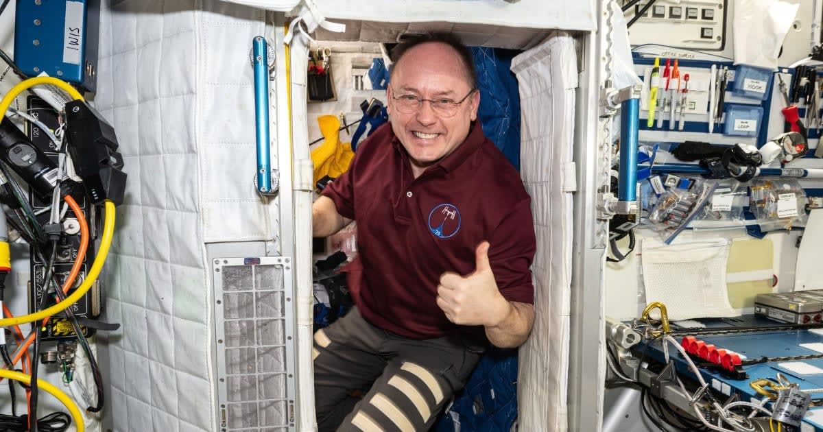 NASA astronaut Mike Fincke poses for a portrait inside his crew quarters aboard the International Space Station’s Harmony module. (Cover Image Source: NASA)