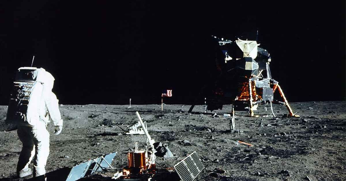 Apollo 11 astronaut Edwin 'Buzz' Aldrin deploys a scientific experiment package on the surface of the moon. In the background is the Lunar Module, with a flag of the United States. (Cover Image Source: Neil Armstrong/NASA/Getty Images)