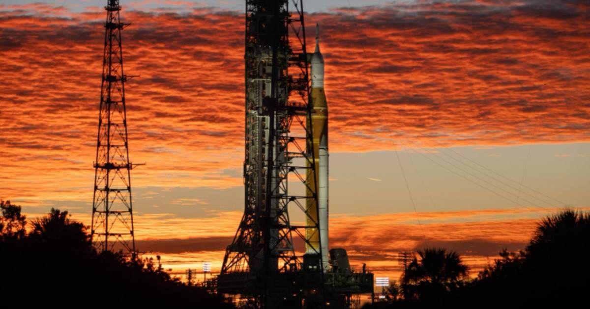 Clouds and the Sun illuminate the sky on Wednesday, Jan. 28, 2026, as NASA’s Artemis II SLS (Space Launch System) rocket and Orion spacecraft stand vertical at Launch Complex 39B. (Cover Image Source: NASA/Cory S Huston)