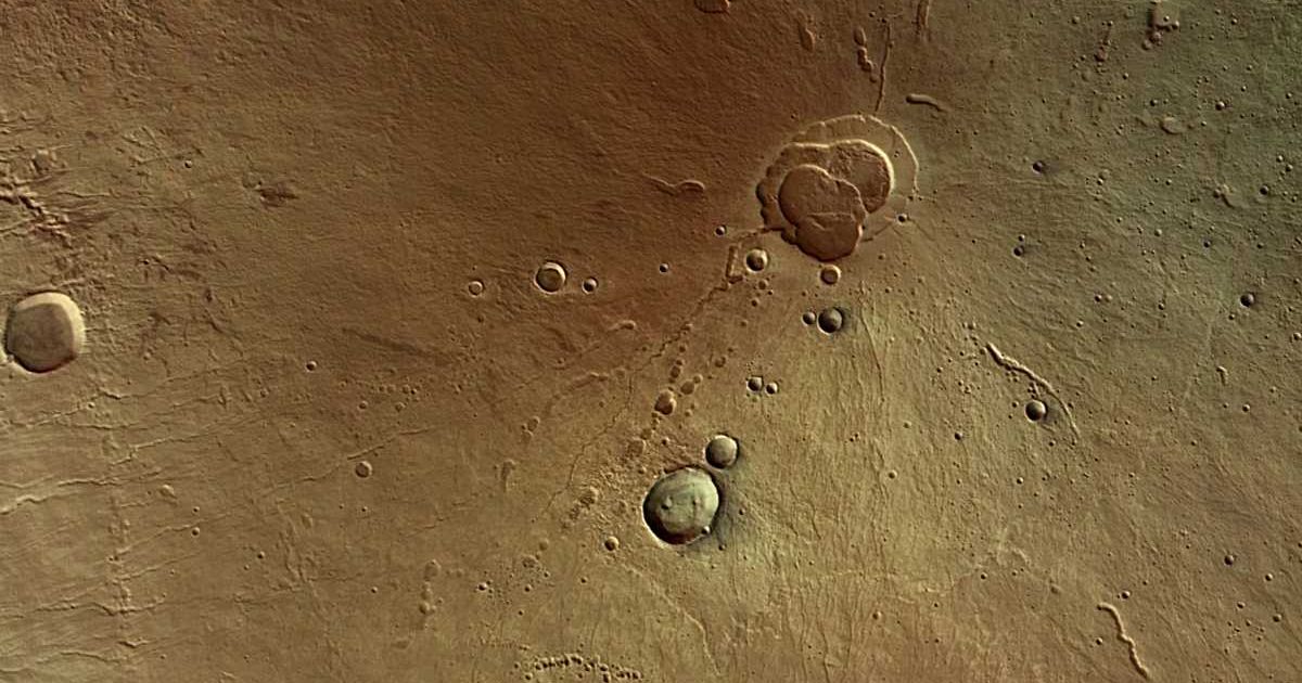 An image of the summit caldera of Hecates Tholus, the northernmost volcano of the Elysium volcano group. [Cover Image Source: ESA/DLR/FU Berlin (G. Neukum)]