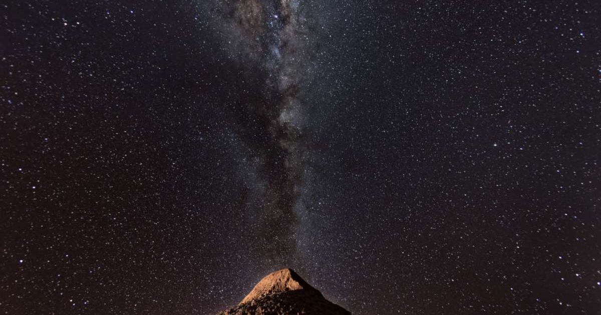 The Milky Way appears over a mountain in the Valle de la Luna in the Atacama Desert. (Cover Image Source: John Moore/Getty Images)