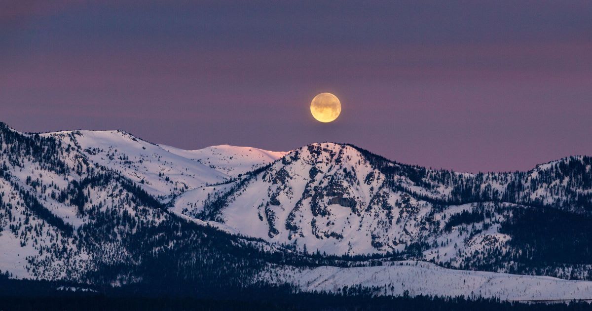 April 5, 2023: A full moon sets above the snow-covered Sierra Nevada. (Representative Cover Image Source: George Rose/Getty Images)
