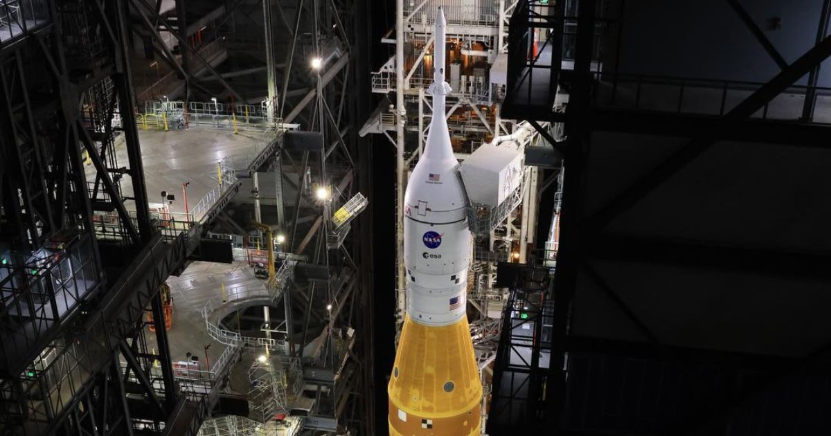 NASA’s crawler-transporter 2 carries the Artemis II SLS rocket with Orion into Kennedy Space Center’s Vehicle Assembly Building on Feb. 25, 2026. (Representative Cover Image Source: NASA/Cory Huston)