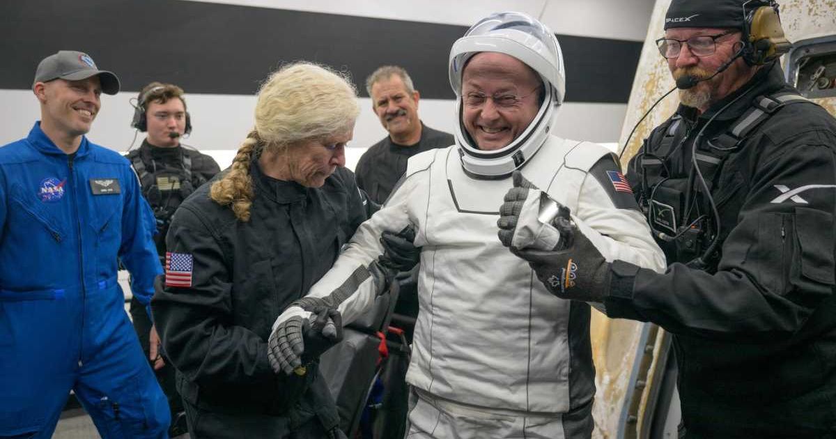 NASA astronaut Mike Fincke helped out of the SpaceX Dragon Endeavour spacecraft onboard the SpaceX recovery ship SHANNON (Cover Image Source- NASA)