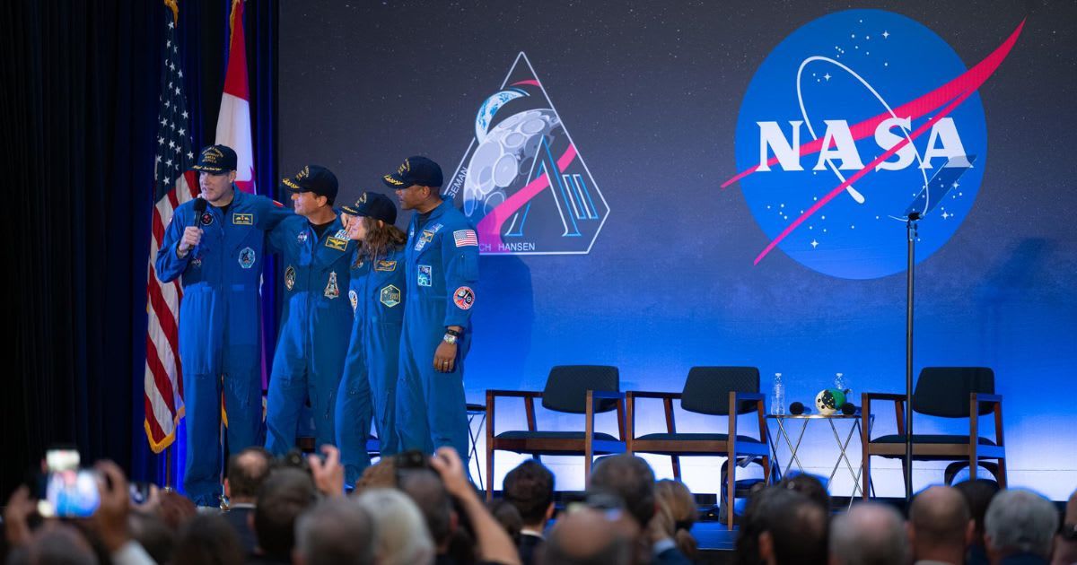Artemis II crew—Jeremy Hansen (CSA), Reid Wiseman, Christina Koch, and Victor Glover—are seen during a return event, Apr. 11, 2026, at Ellington Field in Houston after their Moon mission. (Cover Image Source: NASA/John Kraus)
