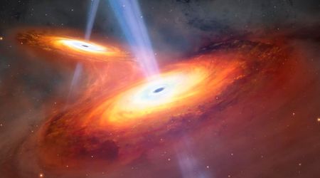 Rare twin quasars caught merging in early universe—they are connected by a cosmic gas bridge