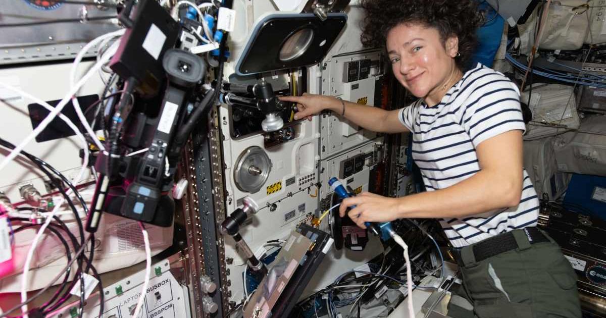 NASA's Jessica Meir swaps scientific hardware inside the BioLab research incubator. (Image Source: NASA | Jack Hathaway)