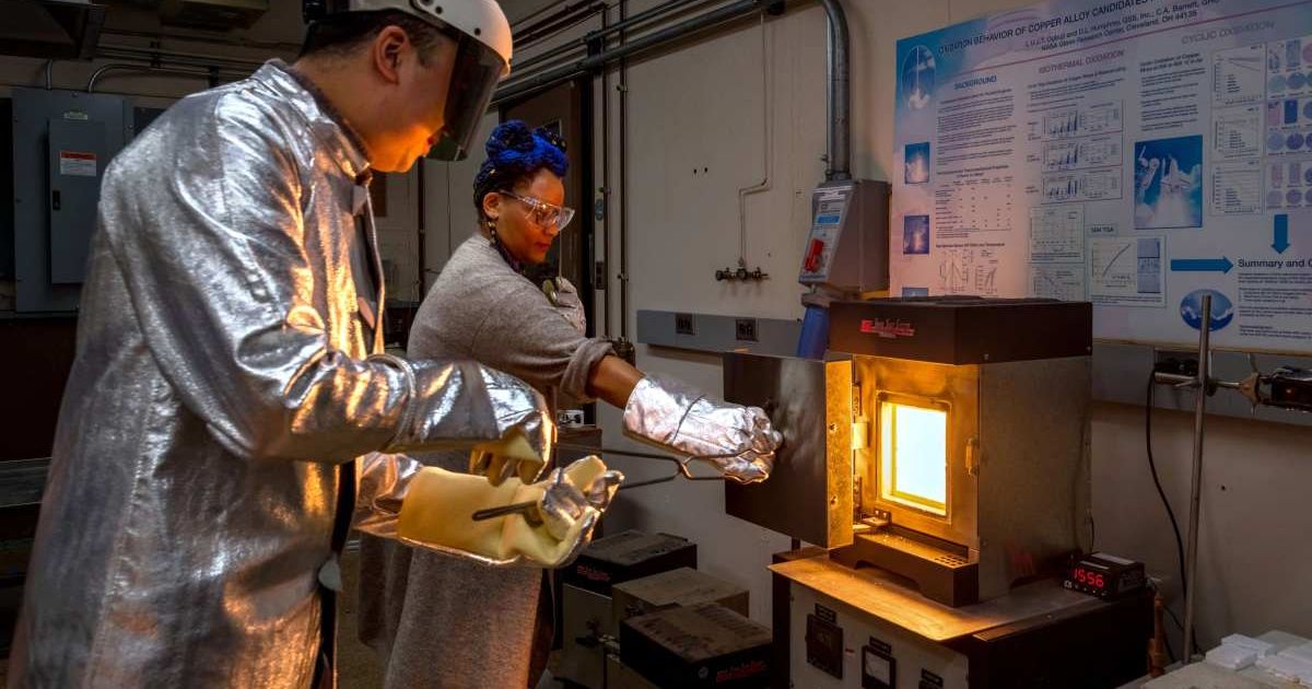 Researchers Dr. Kevin Yu, left, and Dr. Jamesa Stokes prepare to remove a sample of a new material from a furnace inside a laboratory at NASA’s Glenn Research Center. (Cover Image Source: NASA/Jef Janis) 