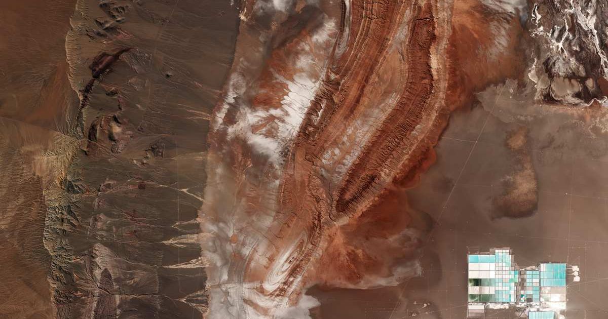 The Salar de Atacama salt flat in the east to the Cordillera Domeyko mountains in the west. (Cover Image Source: ESA)