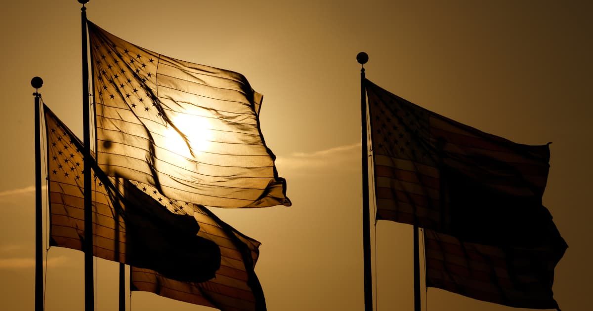 American flags flutter in the wind at the Flag Plaza at Liberty State Park as the sun sets on the summer solstice on June 20, 2024, in Jersey City, New Jersey. (Cover Image Source: Gary Hershorn/Getty Images)