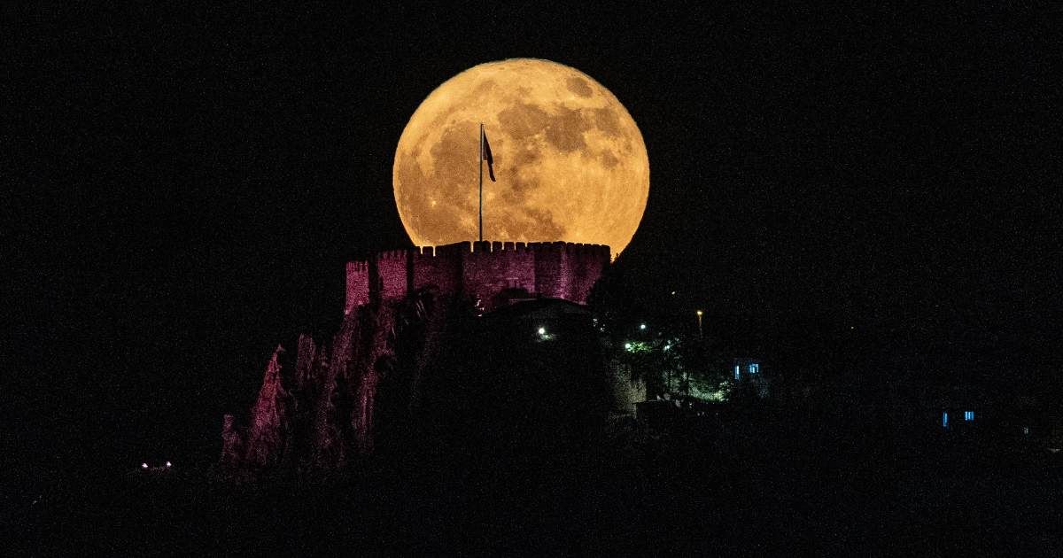 The full Strawberry Moon rises behind historical Ankara Castle in Ankara, Turkey. (Cover Image Source: Serdar Ozsoy/Getty Images)