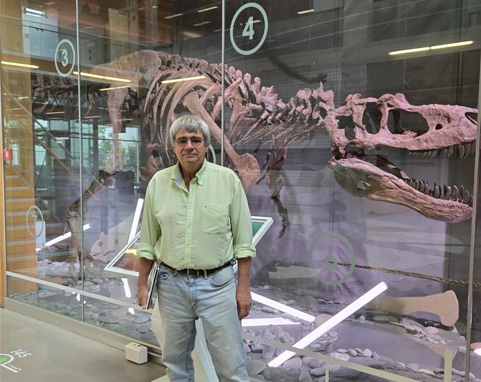 Dr. Philippe Claeys, a visiting professor at the University of British Columbia, in front of an exhibit at the Pacific Museum of Earth.