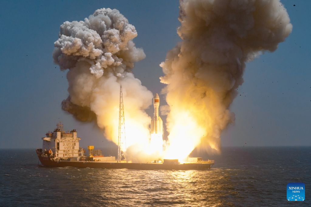 A Gravity-1 carrier rocket carrying nine satellites blasts off from waters off the coast of Shanghai, east China, July 21, 2026.