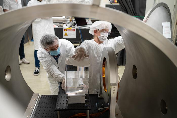 Photo shows researchers in Jonathan Richardson’s group testing a novel adaptive optics device designed to precisely reshape the surfaces of LIGO’s main mirrors.