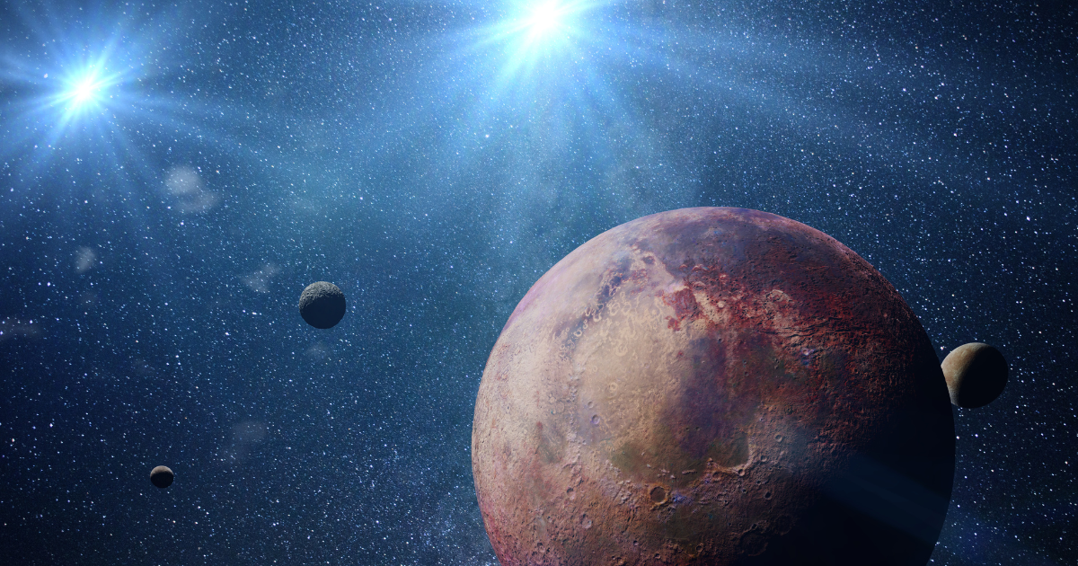Image of an exoplanet with exo-moons orbiting an alien binary star system. (Image Source: dottedhippo/Getty Images)