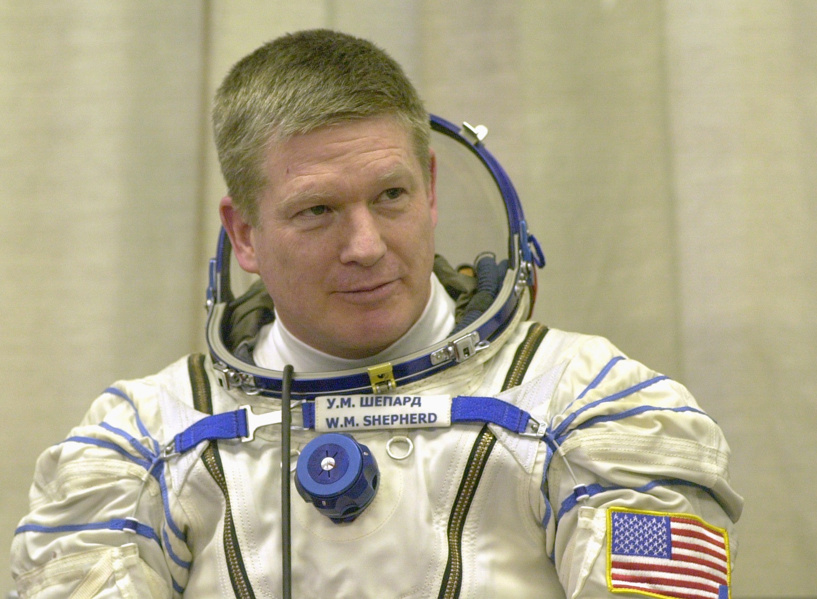 Expedition 1 commander William M. (Bill) Shepherd, wearing a Sokol suit, awaits a seat check for the Soyuz spacecraft at Baikonur.  (Image Source: NASA)