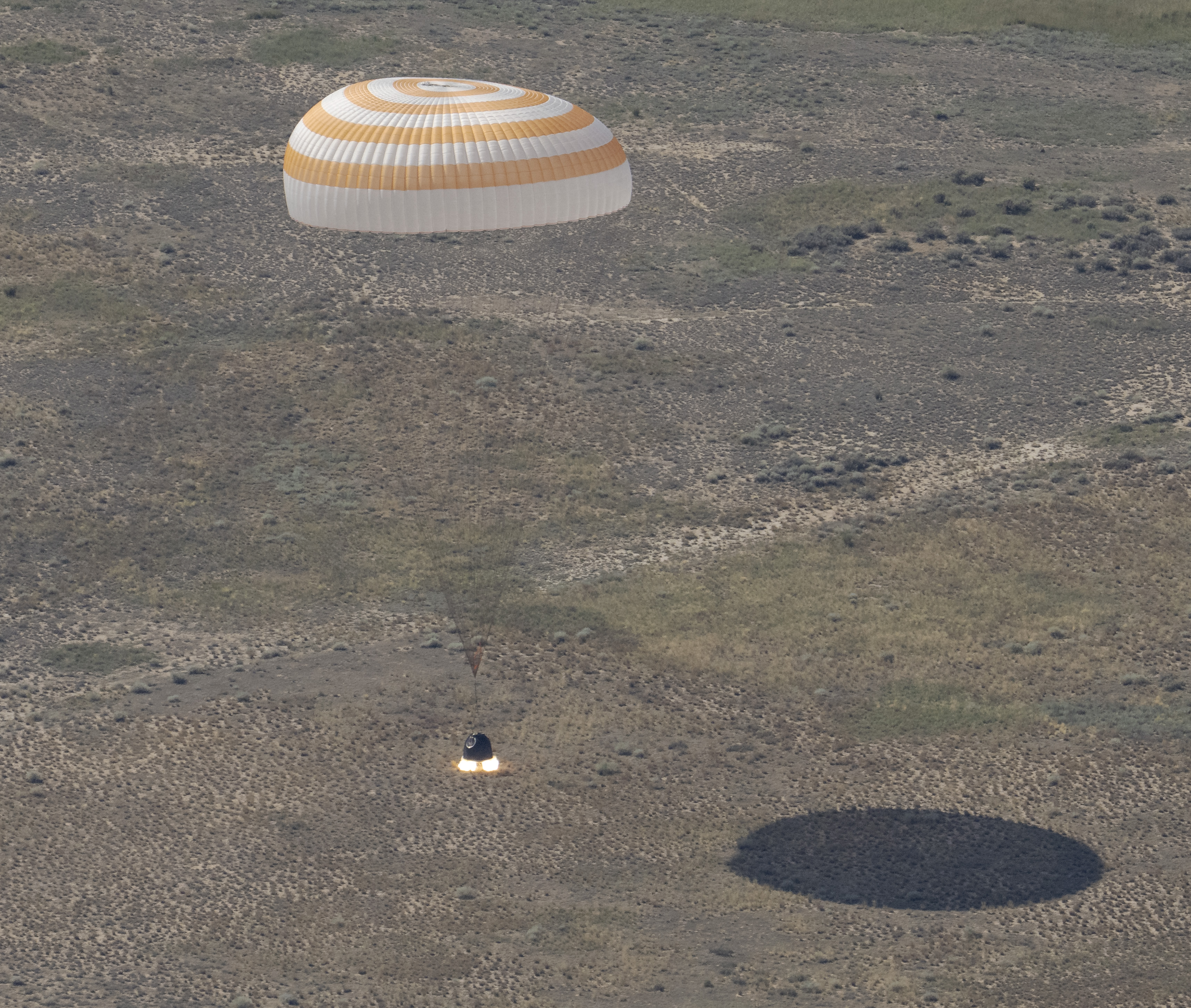The Soyuz MS-28 spacecraft makes a parachute-assisted landing in Kazakhstan, July 26, 2026.