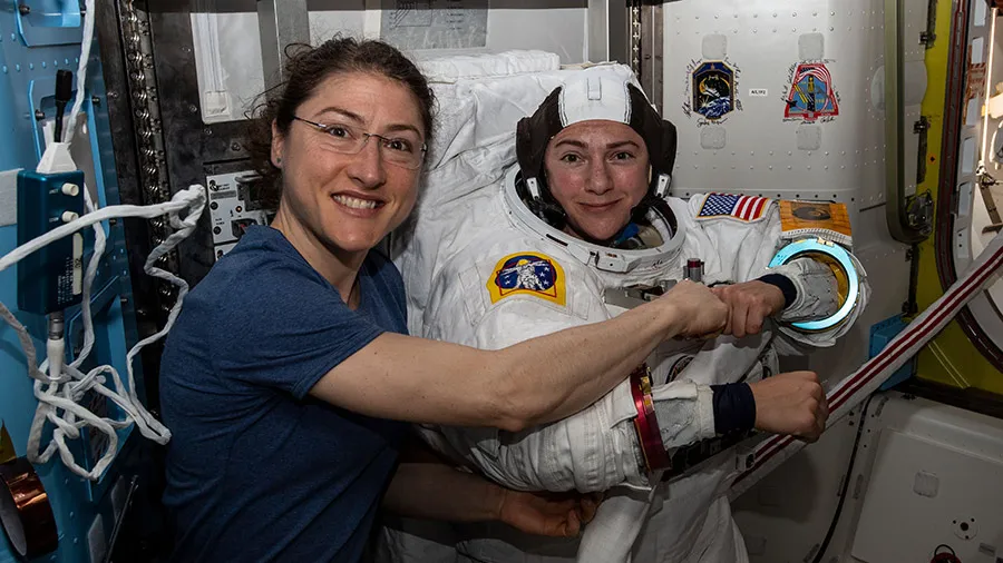 NASA astronauts Chrstina Koch (left) and Jessica Meir prepare for their first spacewalk together inside the U.S. Quest airlock, Octobe 18, 2019.
