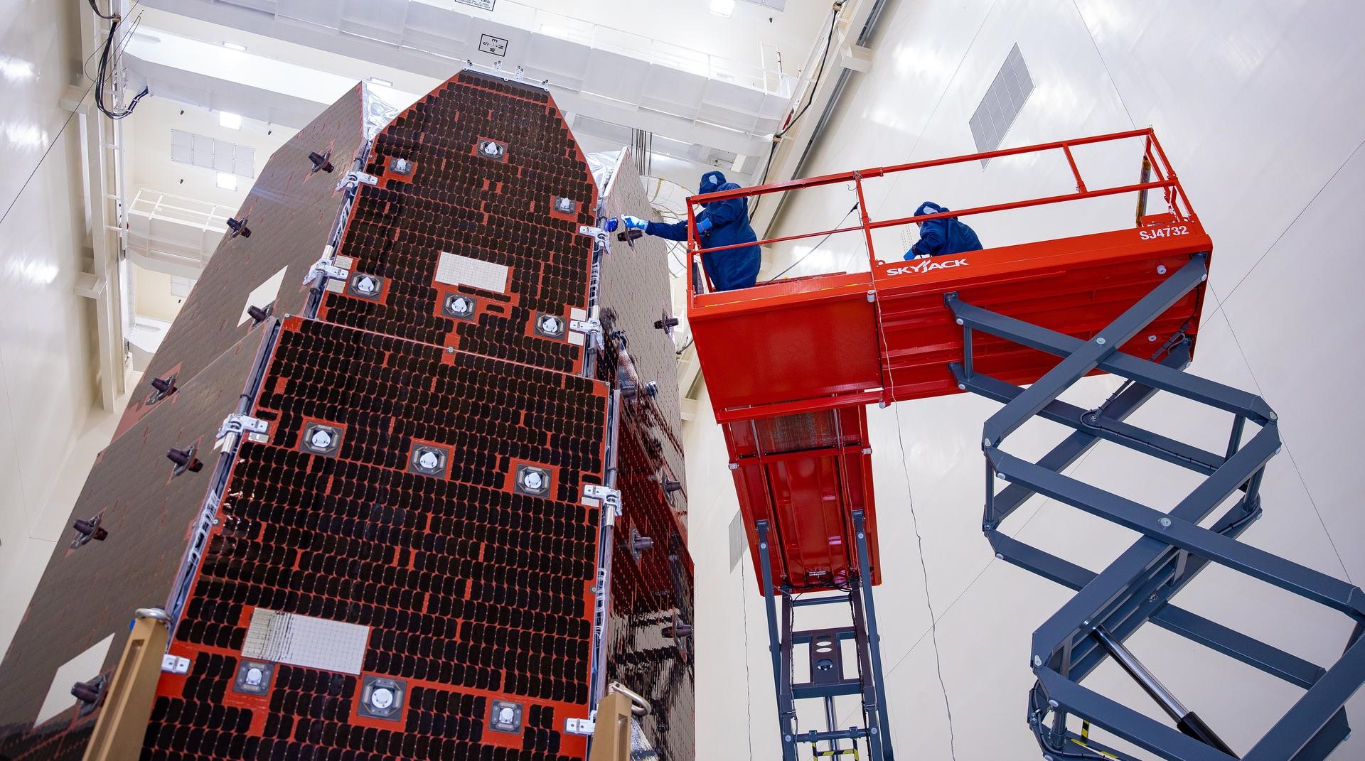 Technicians at Kennedy Space Center in Florida clean and inspect the Solar Array Sun Shield (SASS) on Roman Space Telescope on July 9, 2026. (Image Source: NASA | Jolearra Tshiteya)