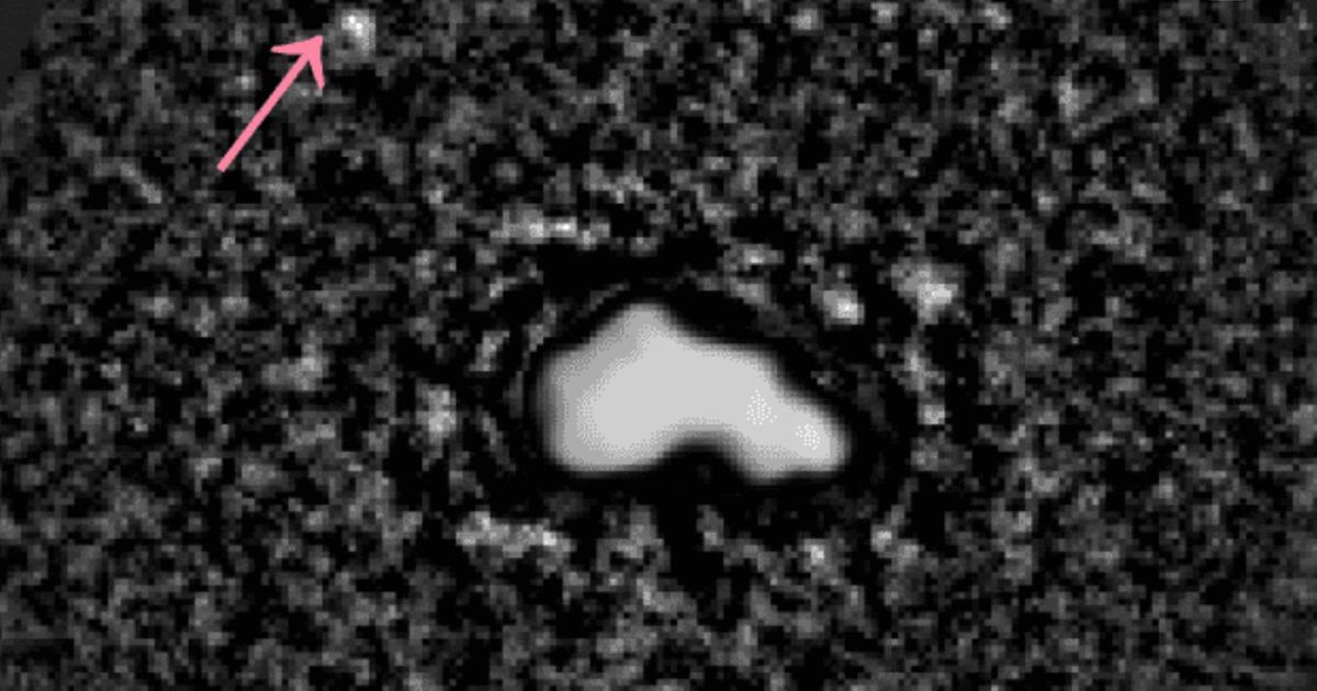 Asteroid 44 Nysa photographed by the Large Binocular Telescope on February 15, 2026. Its tiny moon is marked with an arrow. (Cover Image Source: Very Large Telescope/Large Binocular Telescope/Minker et al., 2026)