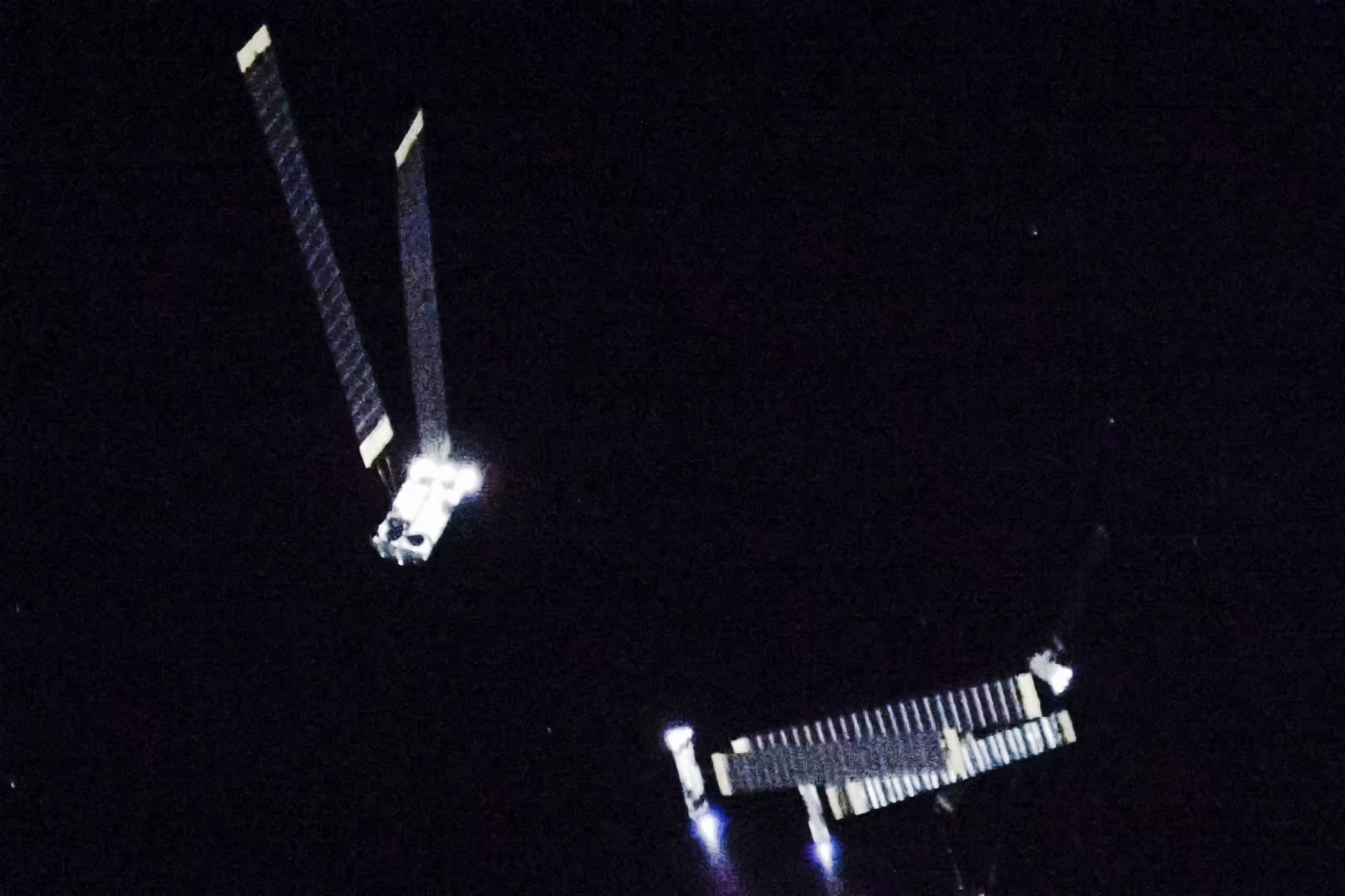 Starlink V3 satellites firing their thrusters during deployment in low-Earth orbit on Starship's test flight, July 24, 2026.