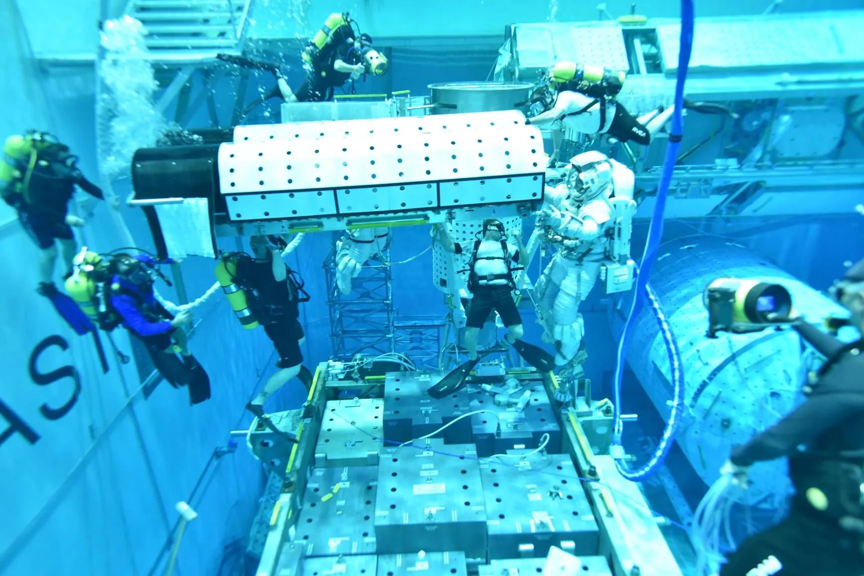 Astronauts training underwater at the Neutral Buoyancy Lab (NBL) located at NASA’s Johnson Space Center in Houston, Texas.