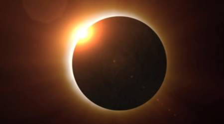 Why are total solar eclipses so rare, and how can you watch one safely?