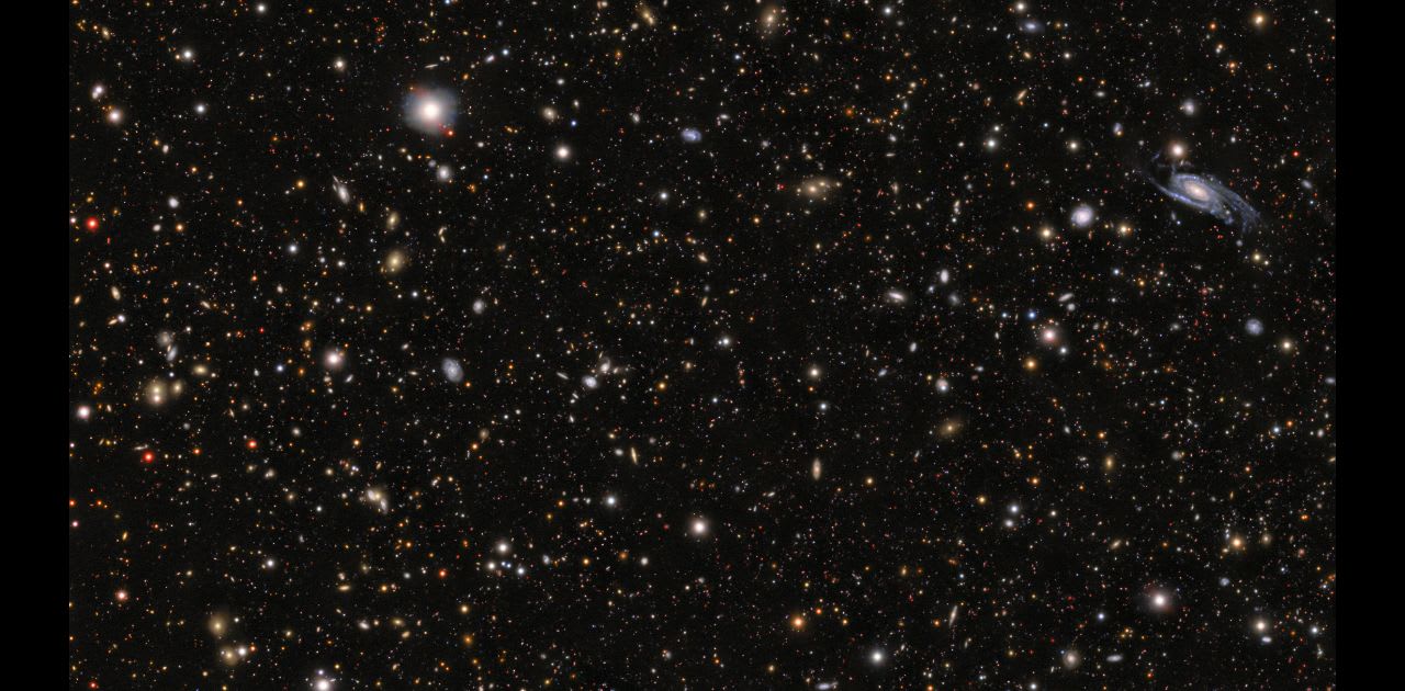 Supernova SN 2026gzf, detected by the Einstein Probe on 21 March 2026, appears as a bright blue dot within the galaxy located in the middle of the upper third at the center of this image.